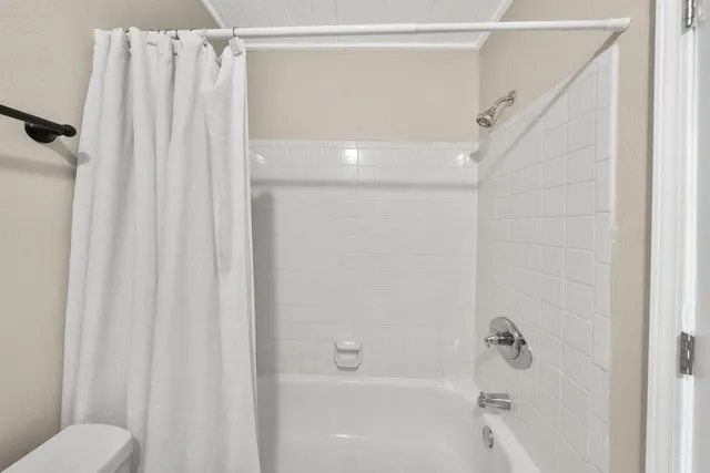 a bed room with a bed and a chandelier