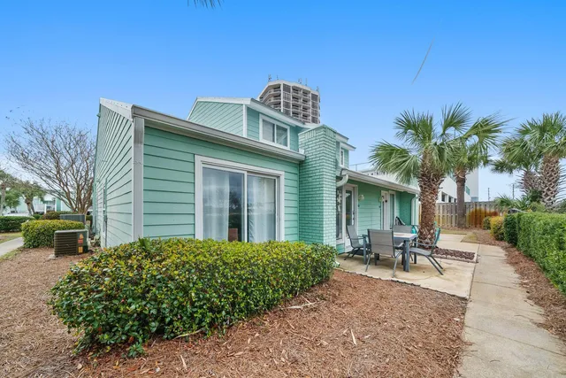 an aerial view of a house with outdoor space