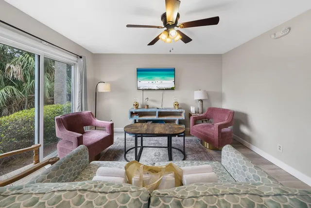 a living room with furniture and a large window