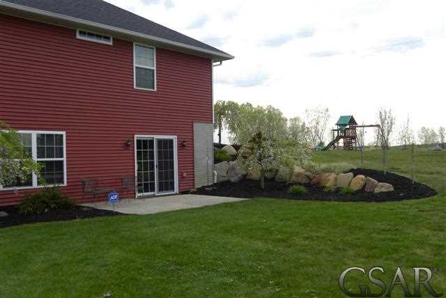 1983 East Bennington Road Owosso, MI 48867 - Photo 28 of 30 Walk-out side patio and landscape