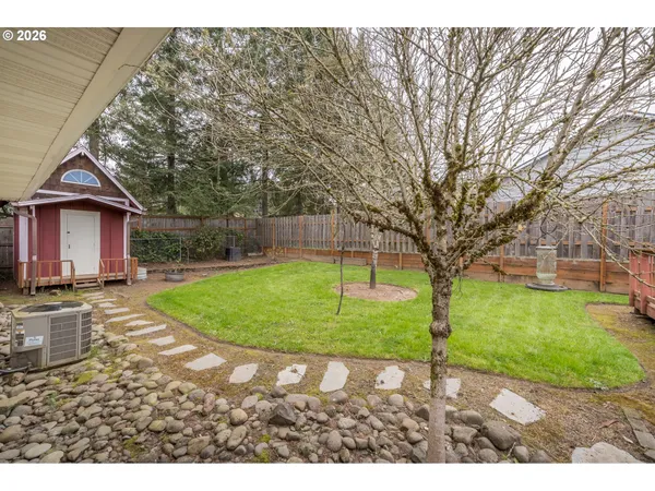 a view of a house with a backyard