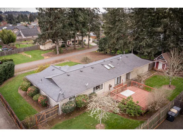 a aerial view of a house with a yard