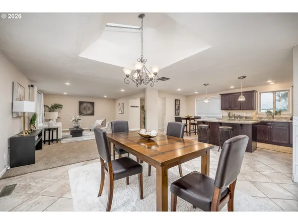 a dining room with a table and chairs