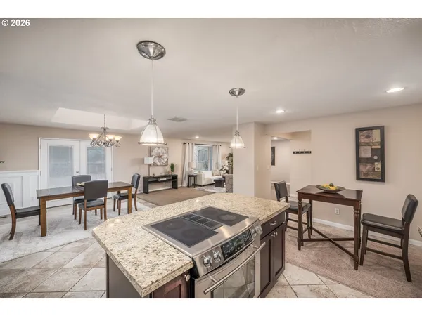 a living room with furniture a table and chairs