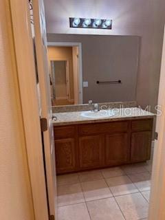 1027 Orca Court Holiday, FL 34691 - Photo 11 of 14 a bathroom with a sink and a mirror