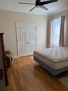 a bedroom with a bed and a chair