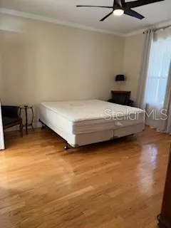 a bedroom with a bed and a table in it