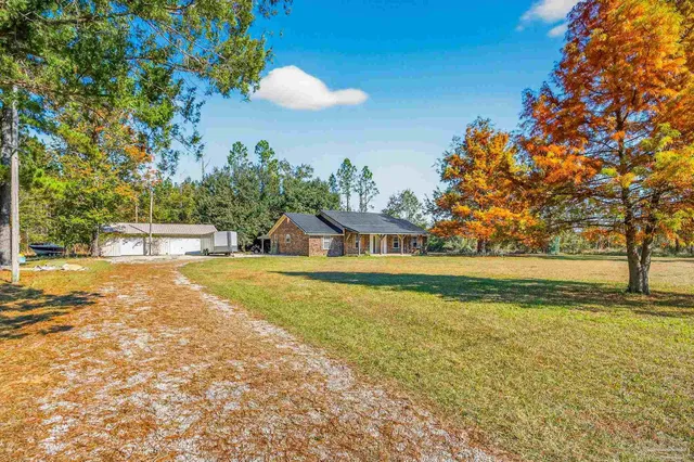 a view of a swimming pool with an outdoor space and seating area