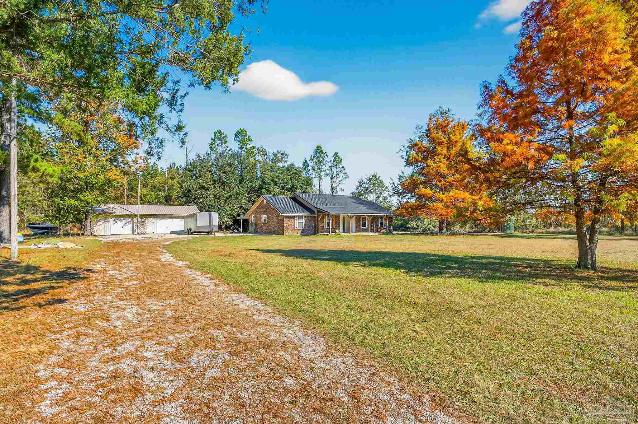 a view of a swimming pool with an outdoor space and seating area