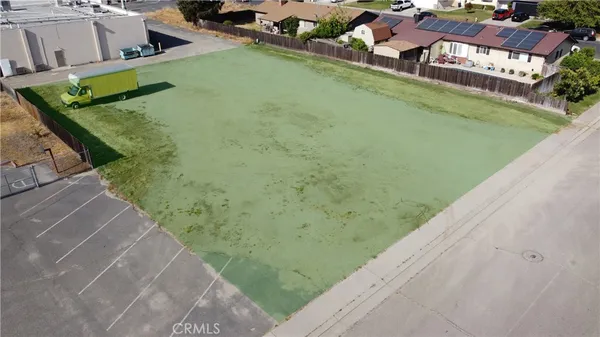 an aerial view of a house with swimming pool