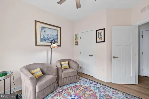 a living room with furniture and a rug