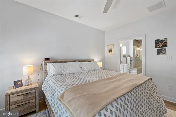 a bedroom with a bed and a dresser