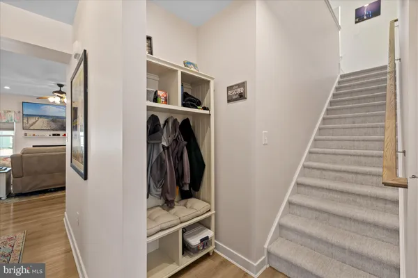 a view of a hallway with closet and a utility room