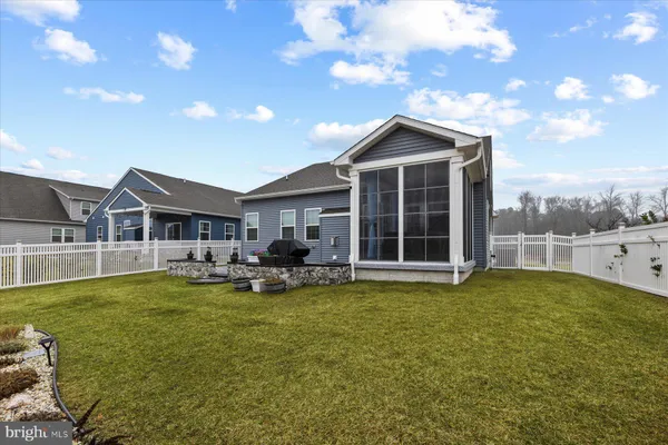 a view of a house with a yard porch and sitting area