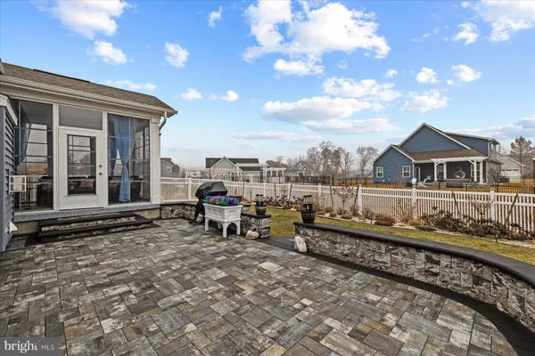 a view of a house with swimming pool and a yard