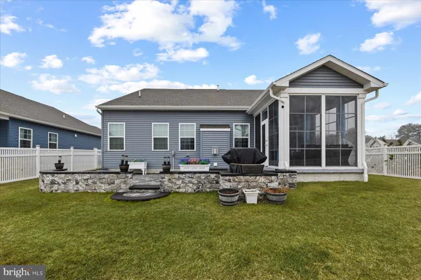 a front view of house with swimming pool and porch