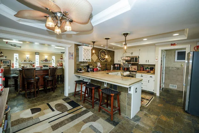 a kitchen that has a lot of cabinets in it