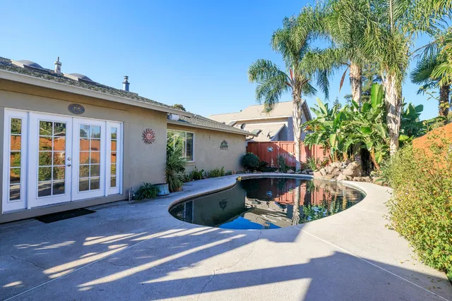 a bench sitting on top of a wooden floor