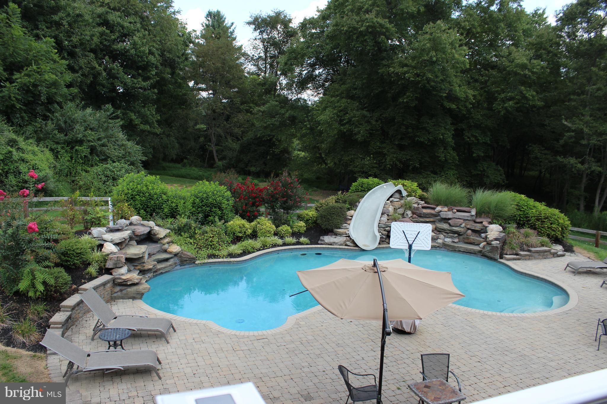 6042 Detrick Road Mount Airy, MD 21771 - Photo 7 of 30 Gorgeous pool, waterfalls, Stone patio on 6 acres