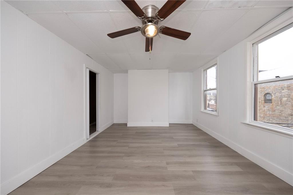 108 Margaret Street McKees Rocks, PA 15136 - Photo 16 of 29 wooden floor in an empty room with a window