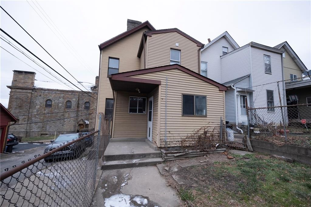 108 Margaret Street McKees Rocks, PA 15136 - Photo 23 of 29 a view of a white house with large windows