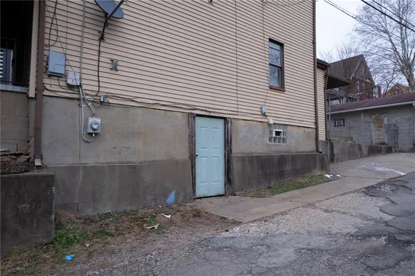 a front view of a house with parking