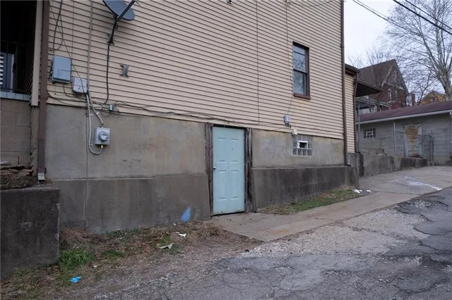 a front view of a house with parking