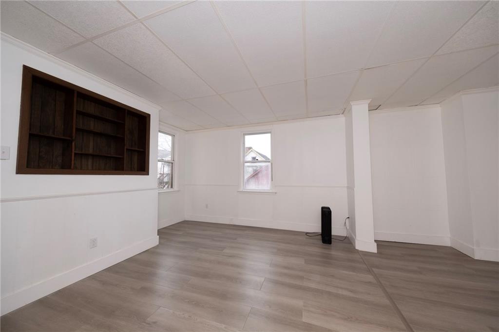 108 Margaret Street McKees Rocks, PA 15136 - Photo 7 of 29 a view of an empty room with wooden floor and a window