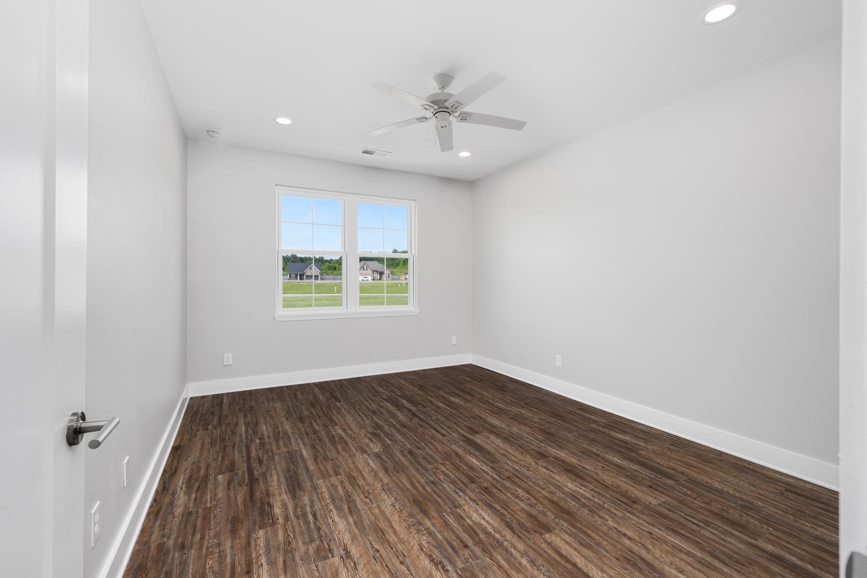 447 Abbey Road, Unit D Munford, TN 38058 - Photo 11 of 20 wooden floor in an empty room with a window