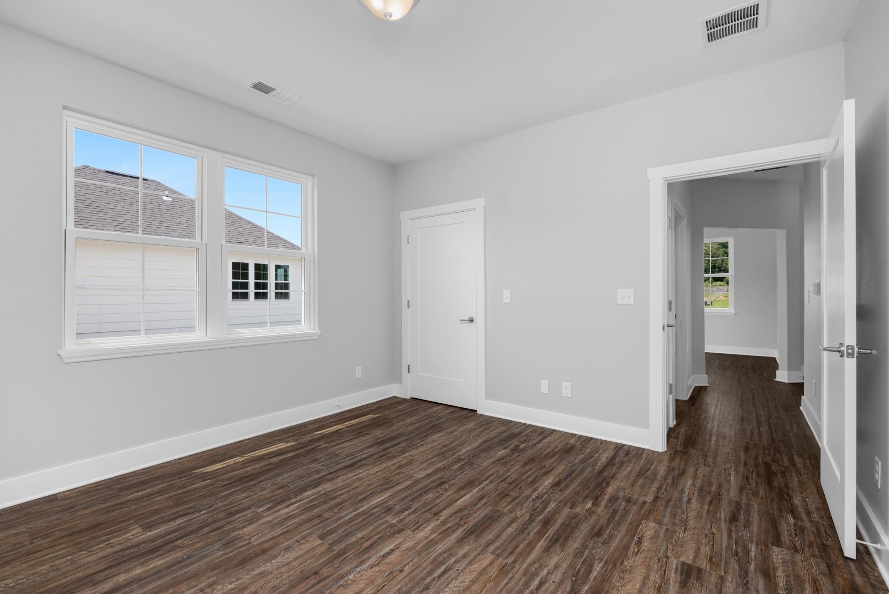 447 Abbey Road, Unit D Munford, TN 38058 - Photo 18 of 20 a view of a room with wooden floor and windows
