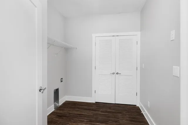a view of a room with wooden floor