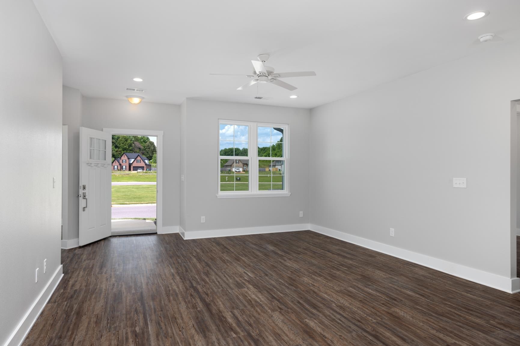 447 Abbey Road, Unit D Munford, TN 38058 - Photo 4 of 20 wooden floor in an empty room with a window
