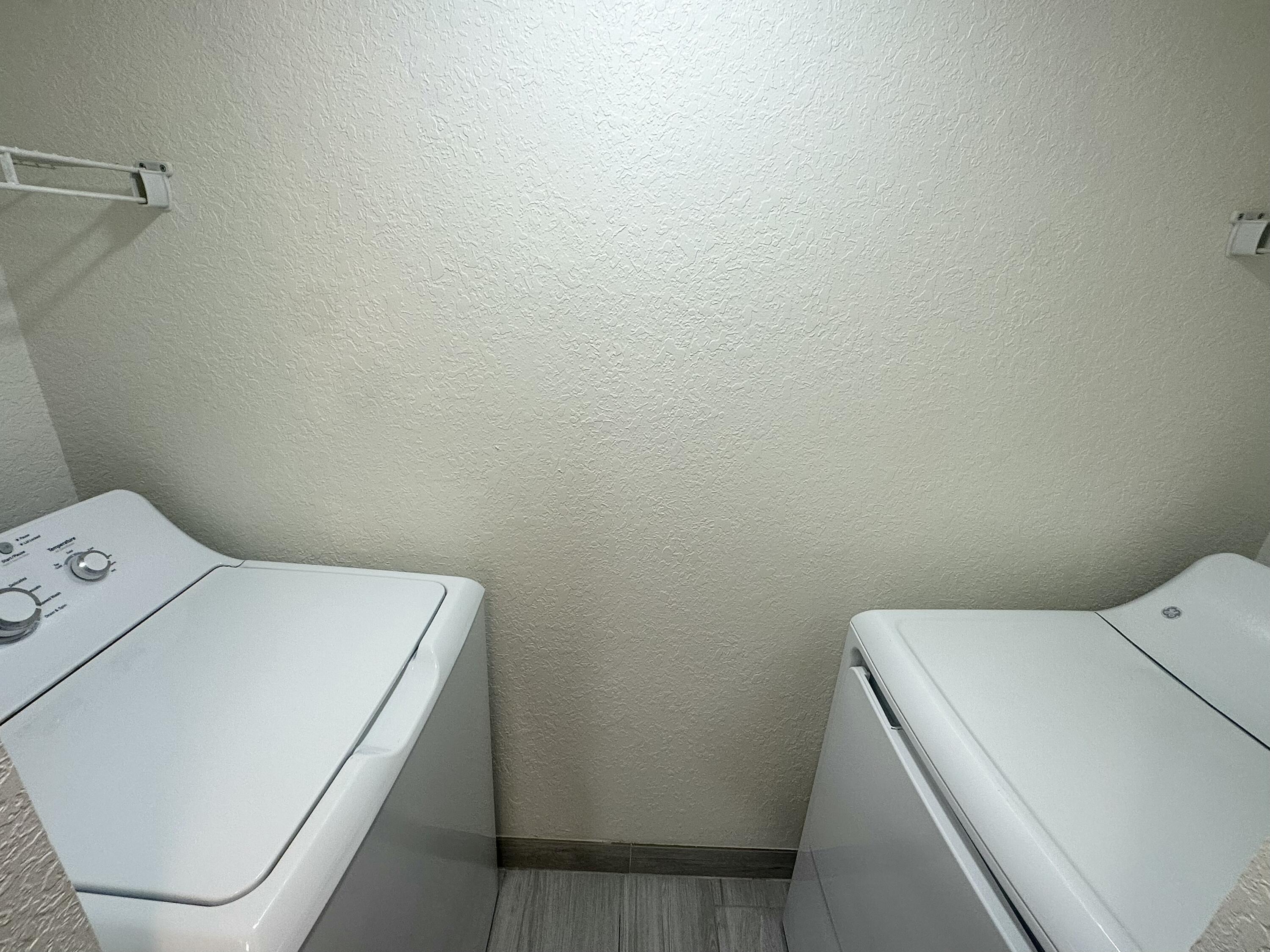 282 Arabian Road Palm Springs, FL 33461 - Photo 17 of 26 a utility room with dryer and washer