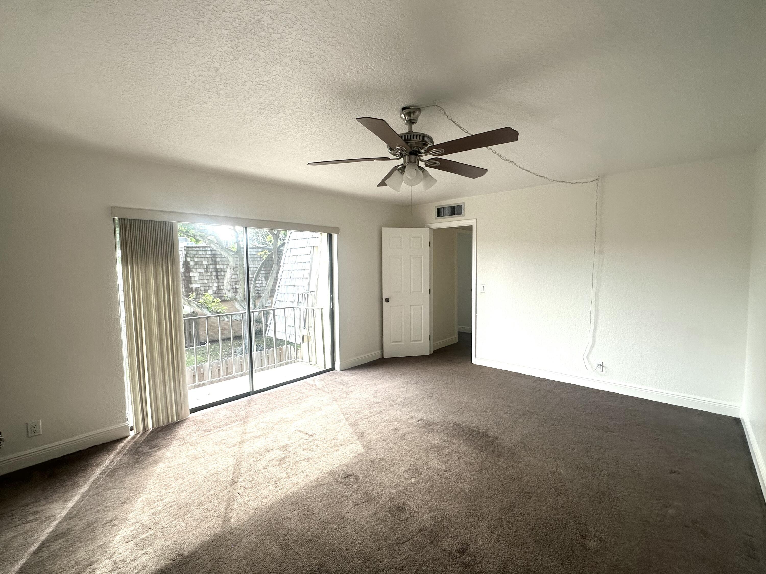 282 Arabian Road Palm Springs, FL 33461 - Photo 19 of 26 a view of an empty room with a window
