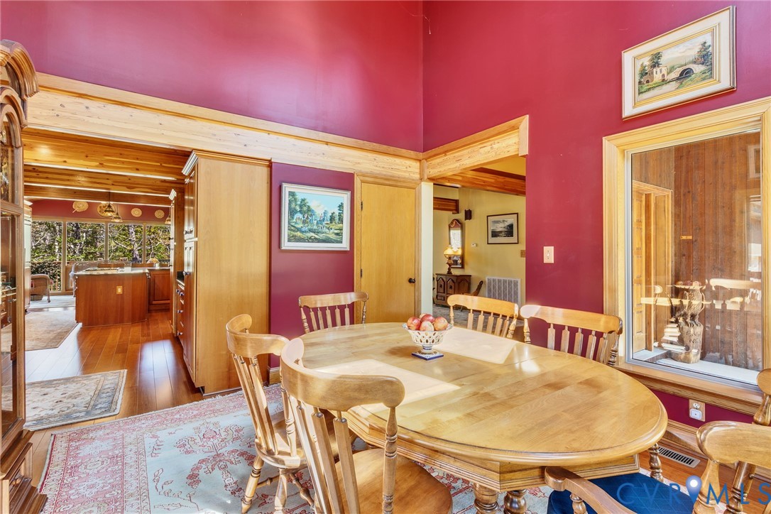 176 Baypointe Court Reedville, VA 22539 - Photo 33 of 60 a dining room with furniture and wooden floor