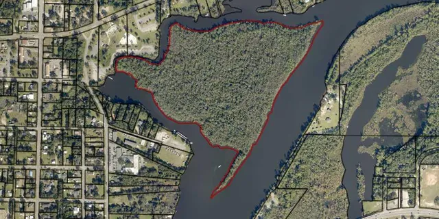 an aerial view of house with yard swimming pool and outdoor seating