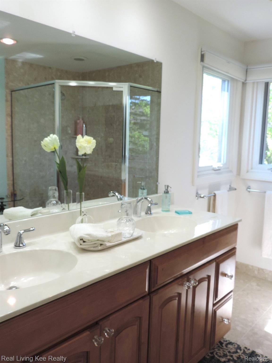 1885 Snowden Court Rochester, MI 48306 - Photo 29 of 47 Renovated Master bath with dual sinks and oversized shower.