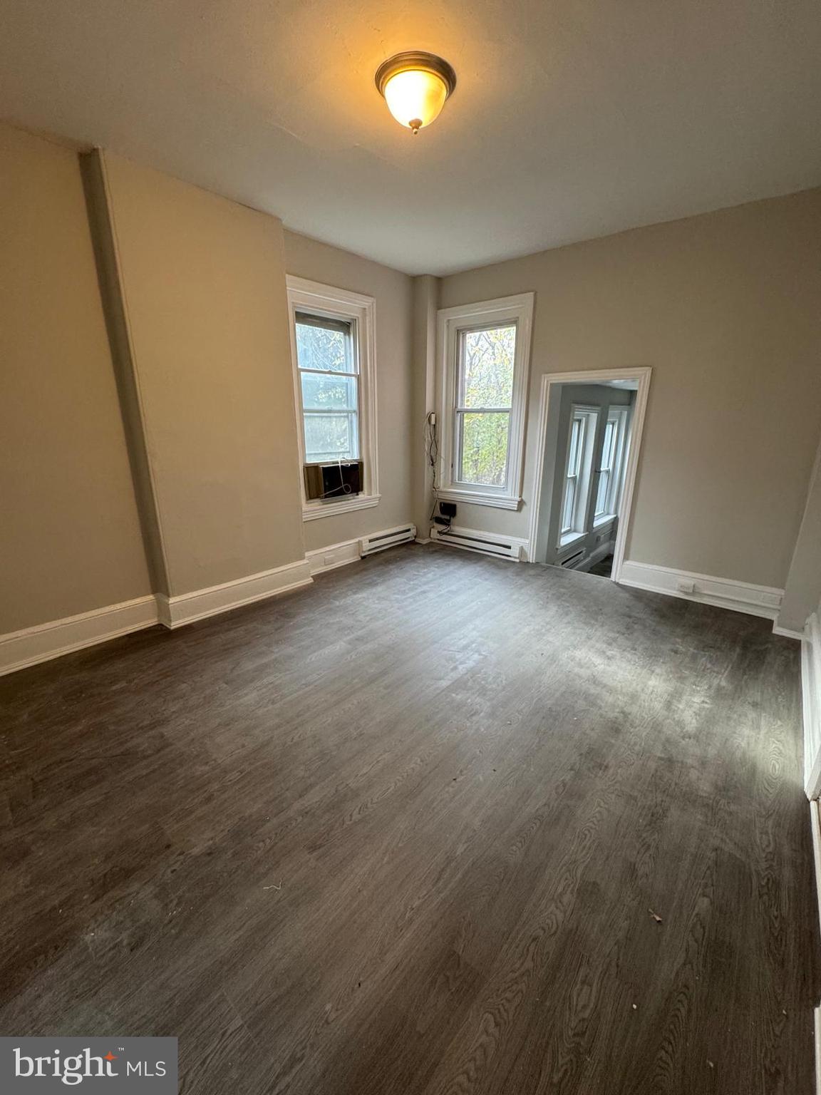 521 Cherry Street, Unit 3 Norristown, PA 19401 - Photo 2 of 7 an empty room with windows