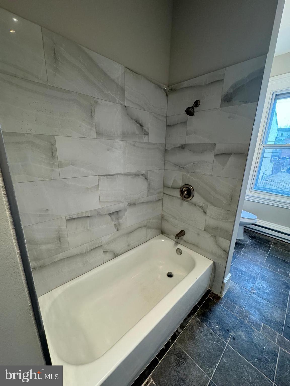521 Cherry Street, Unit 3 Norristown, PA 19401 - Photo 6 of 7 a bathroom with a bathtub and shower