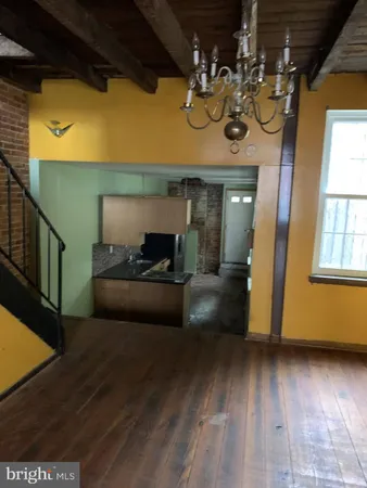 a view of living room with furniture and a window