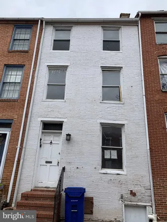 a front view of a house with stairs