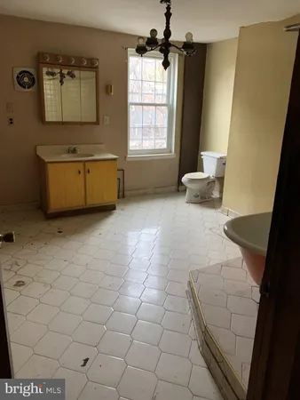a bathroom with a sink a mirror and a bathtub