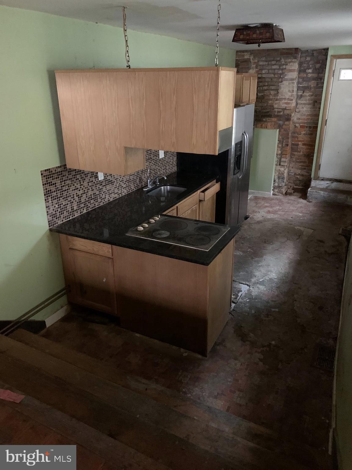 642 Portland Street Baltimore, MD 21230 - Photo 6 of 17 a view of dinning table and chairs