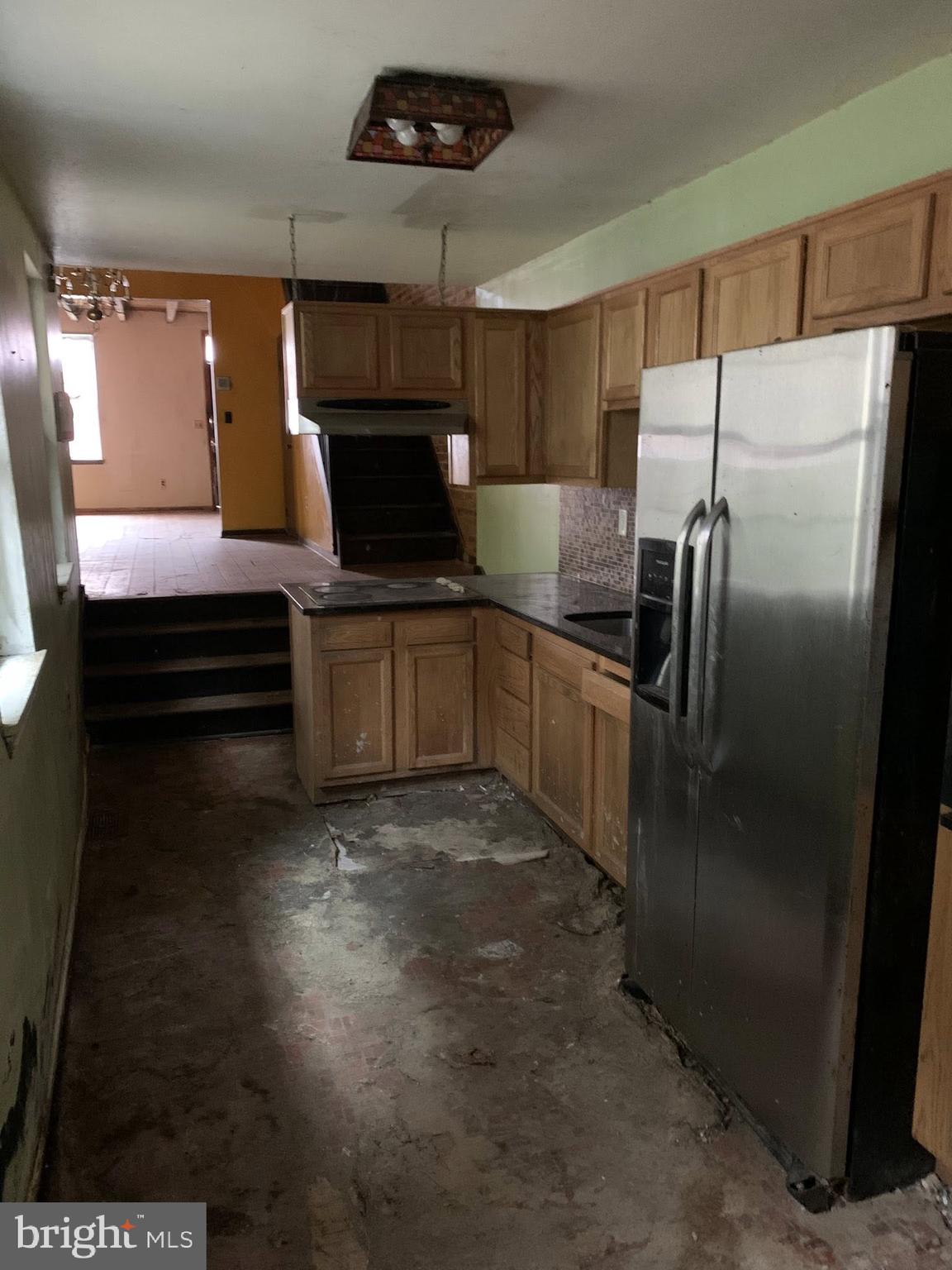 642 Portland Street Baltimore, MD 21230 - Photo 9 of 17 a kitchen with a refrigerator and a sink
