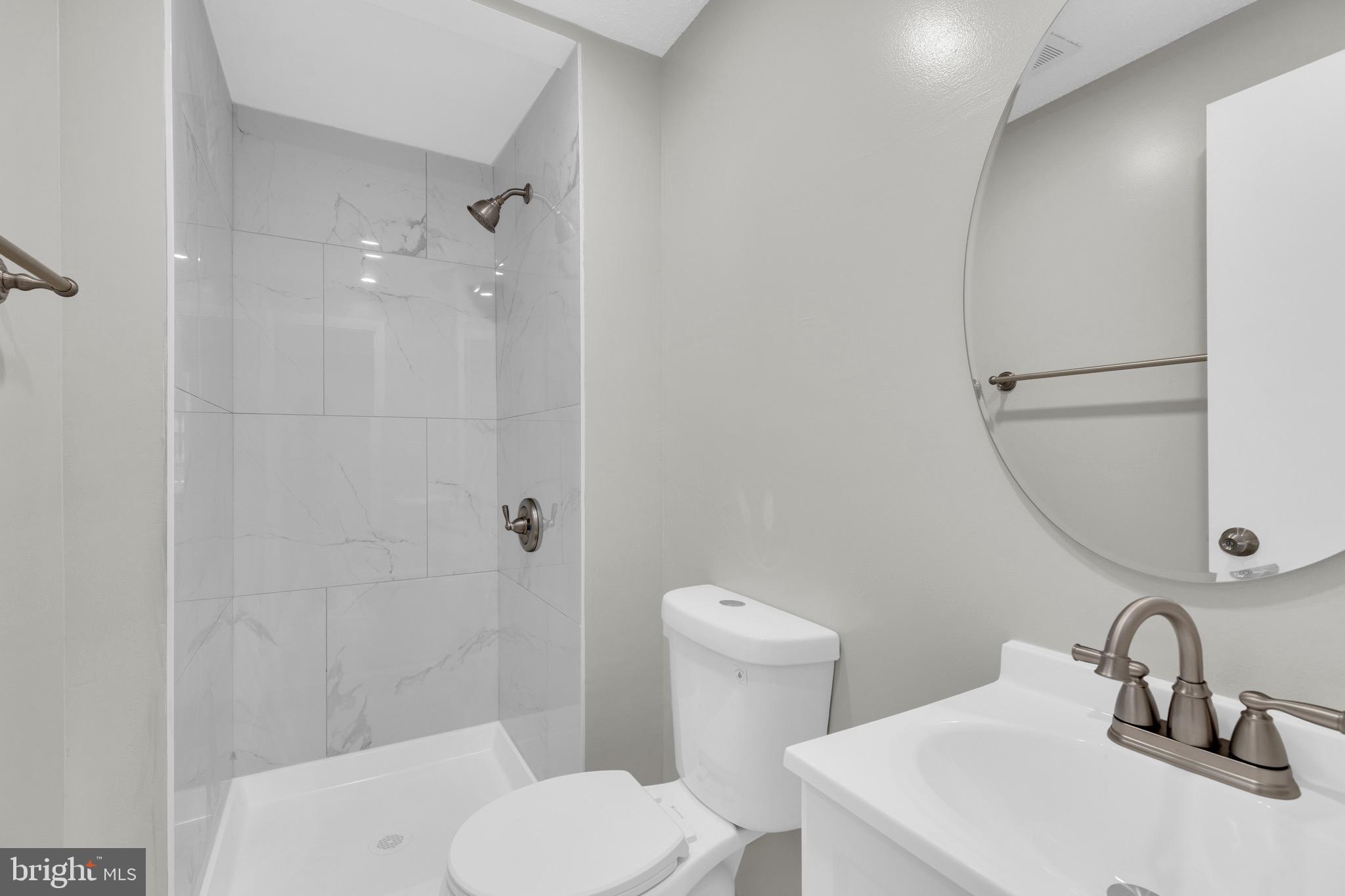 8677 Hickory Ridge Court Springfield, VA 22153 - Photo 16 of 31 a bathroom with a sink toilet and shower