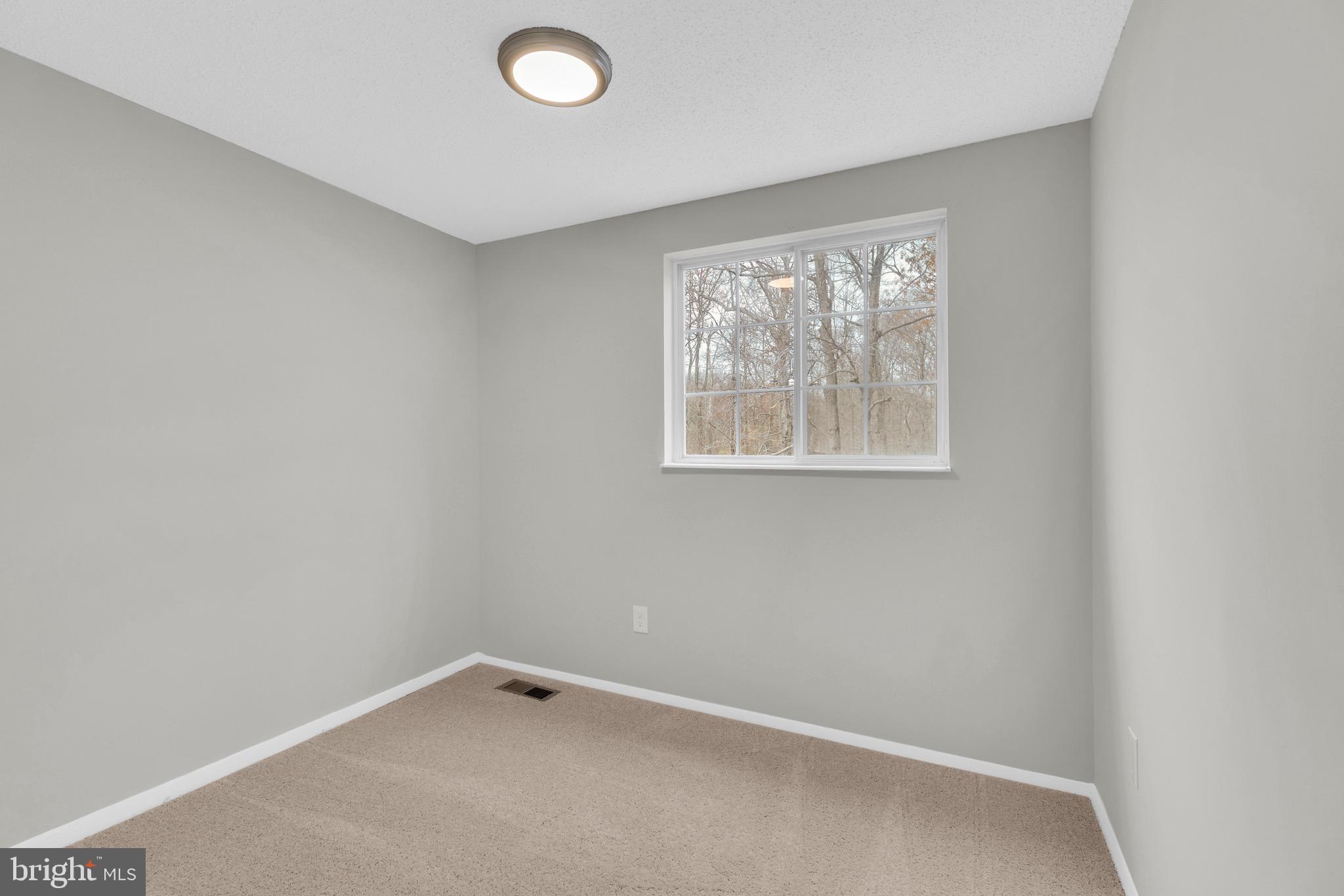 8677 Hickory Ridge Court Springfield, VA 22153 - Photo 19 of 31 an empty room with a window