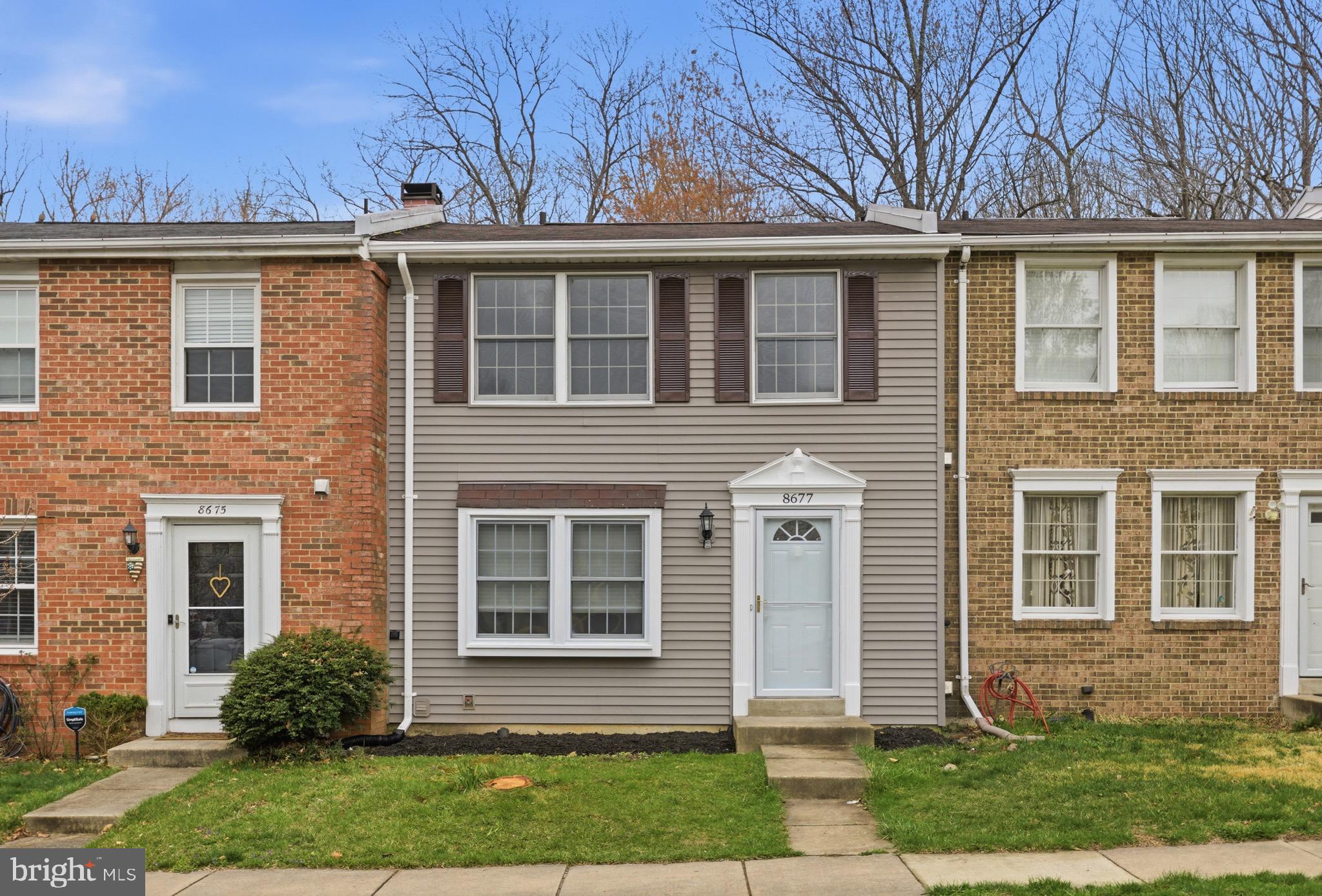8677 Hickory Ridge Court Springfield, VA 22153 - Photo 2 of 31 front view of a house with a yard