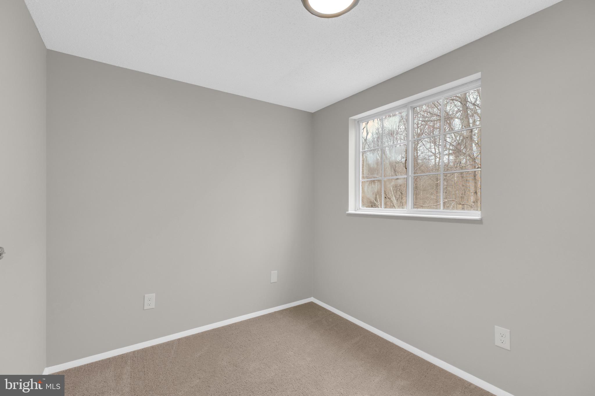 8677 Hickory Ridge Court Springfield, VA 22153 - Photo 22 of 31 an empty room with a window