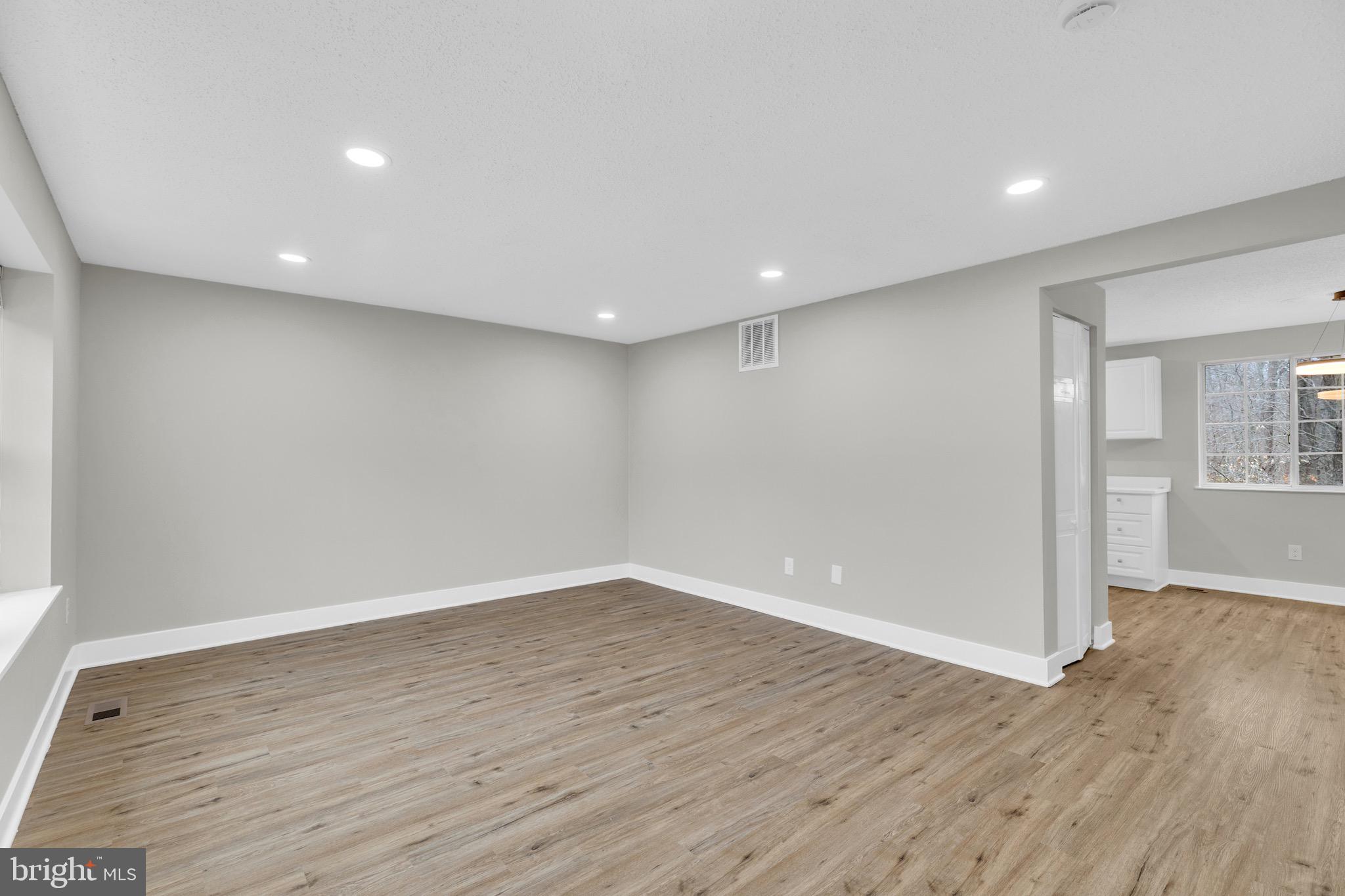 8677 Hickory Ridge Court Springfield, VA 22153 - Photo 5 of 31 wooden floor in an empty room with wooden floor