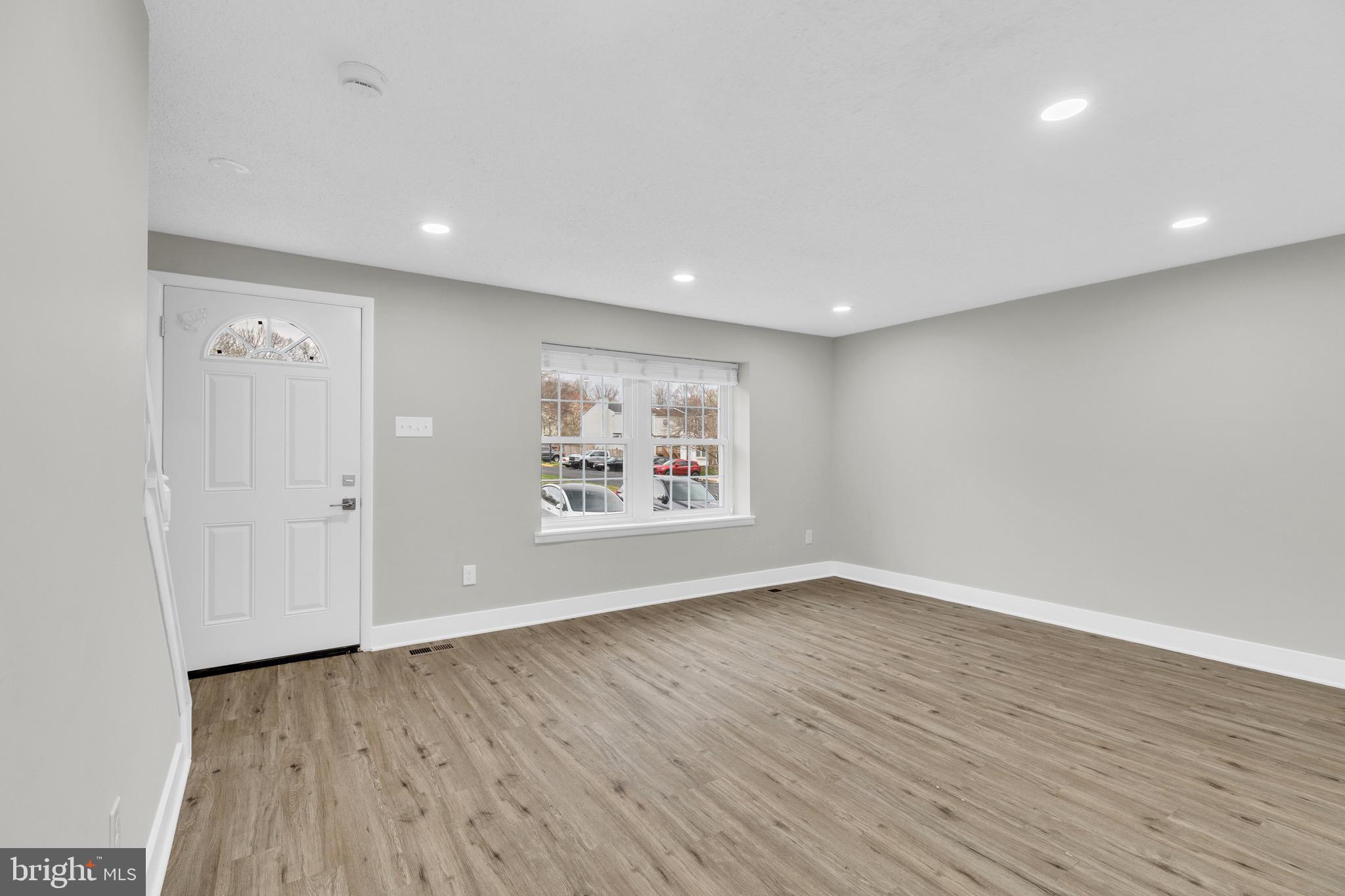8677 Hickory Ridge Court Springfield, VA 22153 - Photo 6 of 31 an empty room with wooden floor and window